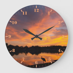 Sunset reflection and sandhill crane silhouette large clock