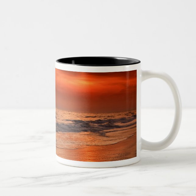 Sunset reflections off clouds and ocean shore Two-Tone coffee mug (Right)