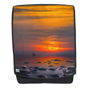 Sunset Reflections on a Rocky Shore Backpack