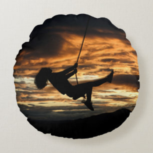 Sunset Silhouette of Girl on Swing Round Cushion