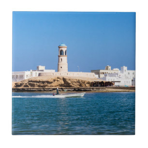 Sur Lighthouse with fisherman boat - Sur, Oman Tile