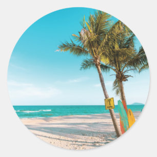 Surf boards on beach throw pillow classic round sticker