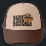 Surf Sand Sunsets Beach Life Palm Tree Trucker Hat<br><div class="desc">"Surf Sand Sunsets" t-shirt is the perfect addition to your summer wardrobe. Whether you're hitting the waves or just lounging on the sand,  this tee has got you covered. Let’s Get ready for a summer filled with surf,  sand,  and unforgettable sunsets.</div>