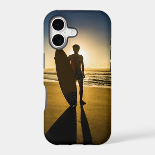 Surfer silhouette during sunrise