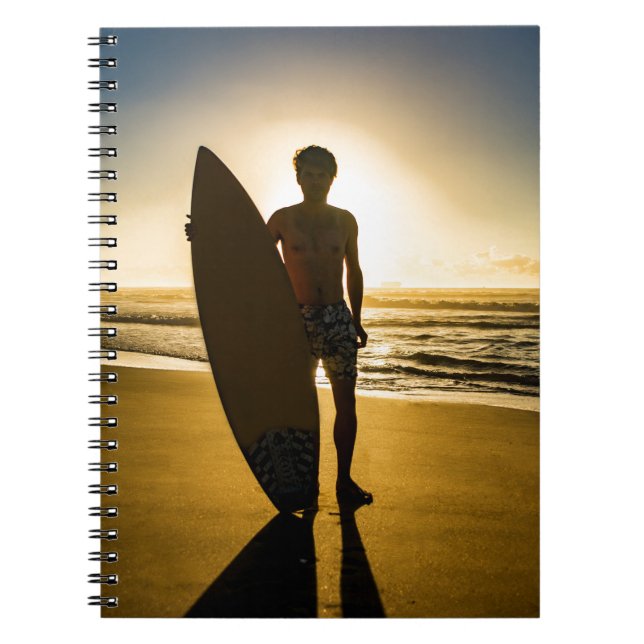 Surfer silhouette during sunrise spiral notebook (Front)
