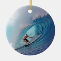 Surfer surfing a huge wave.