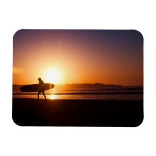 Surfer with Surfboard on Beach at Sunset Magnet