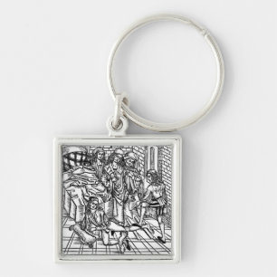 Surgeon directs as an assistant breaks and resets key ring