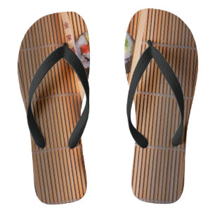 Sushi and wooden chopsticks jandals