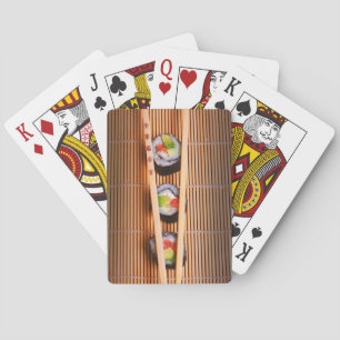 Sushi and wooden chopsticks playing cards