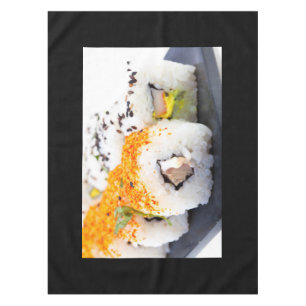 Sushi on a plate tablecloth