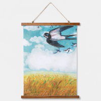 Swallows flying over a wheat field  
