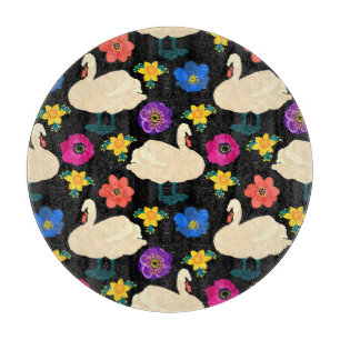 Swans, flowers, hand-drawn black background. cutting board