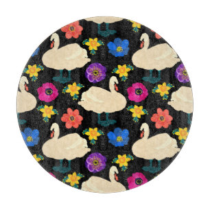 Swans, flowers, hand-drawn black background. cutting board