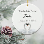 Swans love white names wedding ceramic tree decoration<br><div class="desc">Two beautiful swans in love on a lake bending their heads toghether and forming a heart. White elegant background.  Personalise and add your names and a date.  Your wedding date,  or an event to remember. 

A swan couple stay together for life,  so they are the perfect symbol of love.</div>