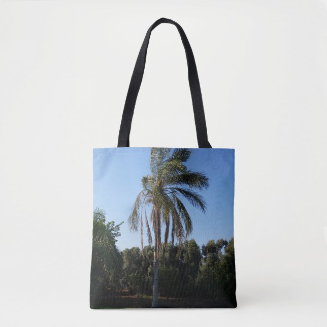 Swaying Palm Tree Under a Clear Sky Tote Bag (Front)