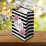 Sweet 16 black stripes pink florals name medium gift bag<br><div class="desc">Classic slim black and white horizontal stripes as background. With girly, feminine and romantic pink roses as decoration. Perfect for an elegant 16th birthday party for her. A white and black frame with templates for name, age and a date. Age number 16 in pink, name and date in black. The...</div>