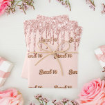 Sweet 16 rose gold glitter pink 16th birthday wrapping paper sheet<br><div class="desc">Elegant,  classic,  glamourous and feminine style party wrapping paper for a Sweet 16,  16th birthday. A girly pink,  rose gold coloured background decorated with  rose gold and pink faux glitter drips.  The word Sweet 16 written with a rose gold balloon style font.</div>