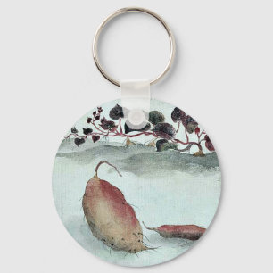 Sweet potato with plant growing in the background key ring