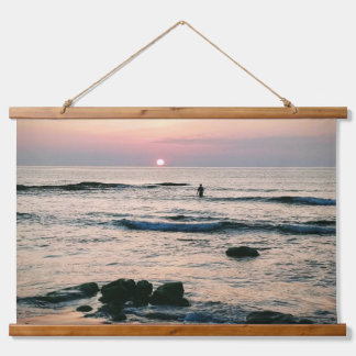 Swimmer entering the sea at sunset hanging tapestry