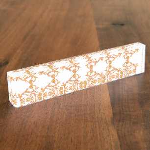 Symmetrical floral pattern with orange motifs rese nameplate