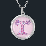 T monogram decorative letter necklace<br><div class="desc">Pretty letter T monogram pendant. Whimsical letter drawing of the capital initial letter T ideal for gifting girls with a name that begins with T. Background colour can be changed if required,  currently light pink. © Original drawing and design by Sarah Trett www.sarahtrett.com for www.mylittleeden.com</div>