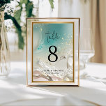 Table Number | Ethereal Shoreline Teal Ocean<br><div class="desc">Complete your reception decor with the Ethereal Shoreline Teal Ocean Tide wedding table number. Featuring a striking deep turquoise and seafoam green watercolor wash with delicate gold-look splatters, this double-sided card brings the beauty of the sea to your guest tables. The clean, minimalist typography ensures that table numbers are easy...</div>