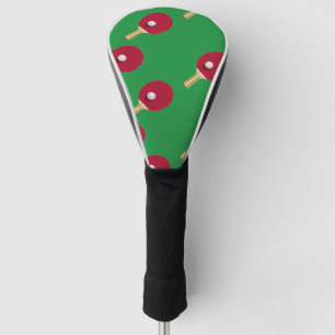 Table tennis racket and ball on green golf head cover