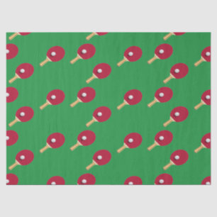 Table tennis racket and ball on green tissue paper