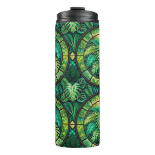 Tall tumbler with lush green tropical leaves 
