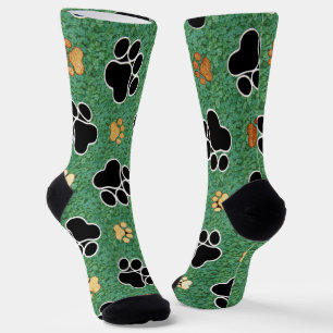 Tan and black paw print on green grass socks