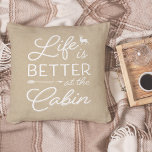 Tan & White Life Is Better At The Cabin Cushion<br><div class="desc">Rustic modern throw pillow features a light tan beige background with "life is better at the cabin" overlaid in white typography. Personalize the reverse side with your family name and year established.</div>