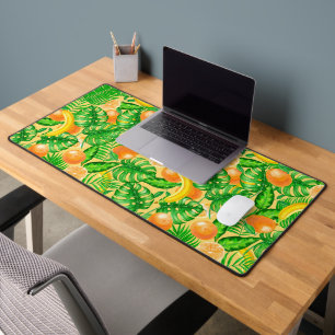 Tangerines, bananas and tropical leaves desk mat