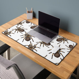 Tarantula on white desk mat