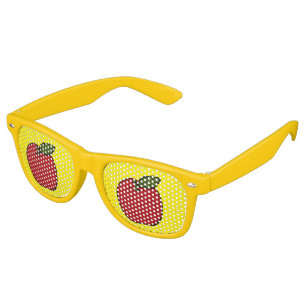 Tasty big red apple on yellow retro sunglasses