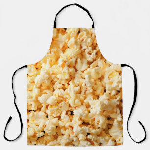 Tasty popcorn on whole background. Food Apron