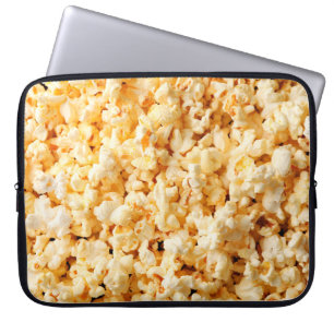 Tasty popcorn on whole background. Food Laptop Sleeve