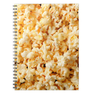 Tasty popcorn on whole background. Food Notebook