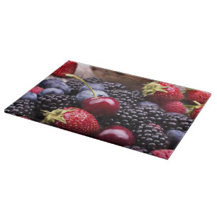 Tasty Summer Fruits On A Wooden Table Cutting Board