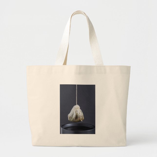Tea bag is hung in a cup (Front)