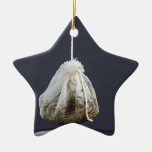 Tea bag is hung in a cup ceramic tree decoration