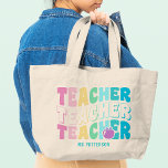 Teacher Modern Rainbow Colours Personalised Name Large Tote Bag<br><div class="desc">Teacher Modern Rainbow Colours Personalised Name Tote Bag features the text "Teacher" in modern rainbow colour repeat script typography with your custom personalised name below. Perfect for your favourite teacher for teacher appreciation,  birthday,  Christmas,  holidays and more. Designed by Evco Studio www.zazzle.com/store/evcostudio</div>