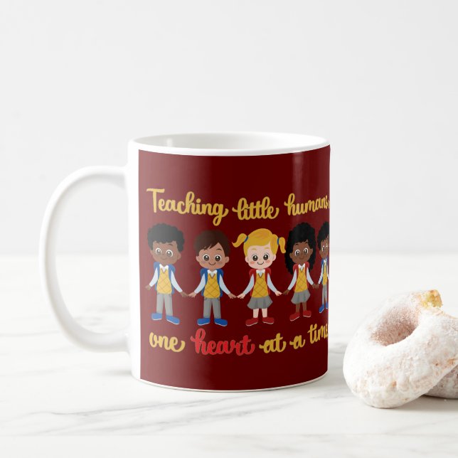 TEACHING LITTLE HUMANS ONE HEART AT A TIME         COFFEE MUG (With Donut)