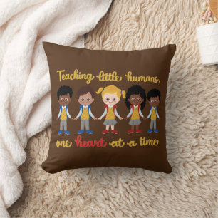 TEACHING LITTLE HUMANS ONE HEART AT A TIME CUSHION