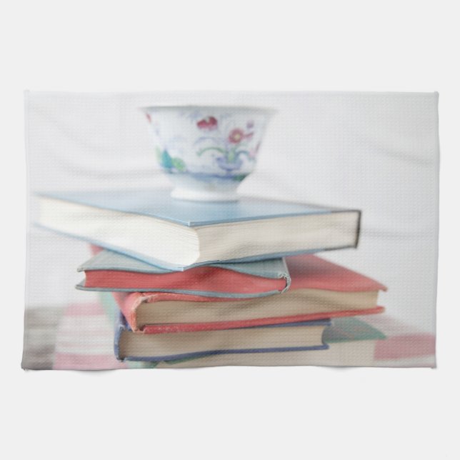 Teacup on book stack tea towel (Horizontal)