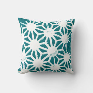 Teal and white geometric pattern cushion