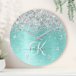 Teal Brushed Metal Silver Glitter Monogram Name Round Clock<br><div class="desc">Easily personalise this trendy chic round clock design featuring pretty silver sparkling glitter on a teal brushed metallic background.</div>