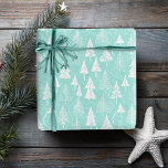 Teal Christmas Tree Pattern#6 ID1009 Wrapping Paper<br><div class="desc">Celebrate a contemporary coastal Christmas with our modern Christmas tree pattern. Featuring stylised trees all in white, on a background of vibrant teal, this wrapping paper design effortlessly combines elegance with festive cheer. Part of our exclusive Coastal Christmas Collection, this modern and stylish pattern is perfect for adding a chic...</div>