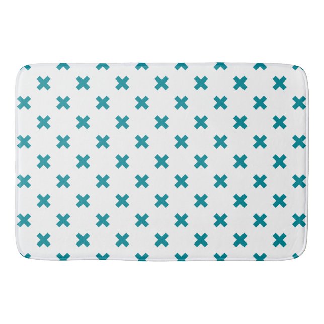Teal cross stitches on white bath mat (Front)