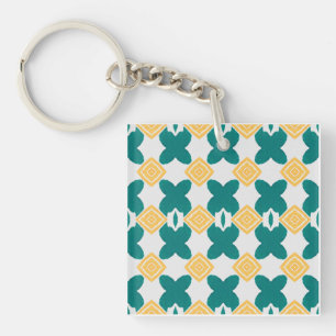 teal-green, butterfly-like shape & yellow diamond key ring